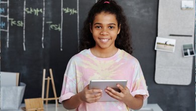 Young Student Holding iPad